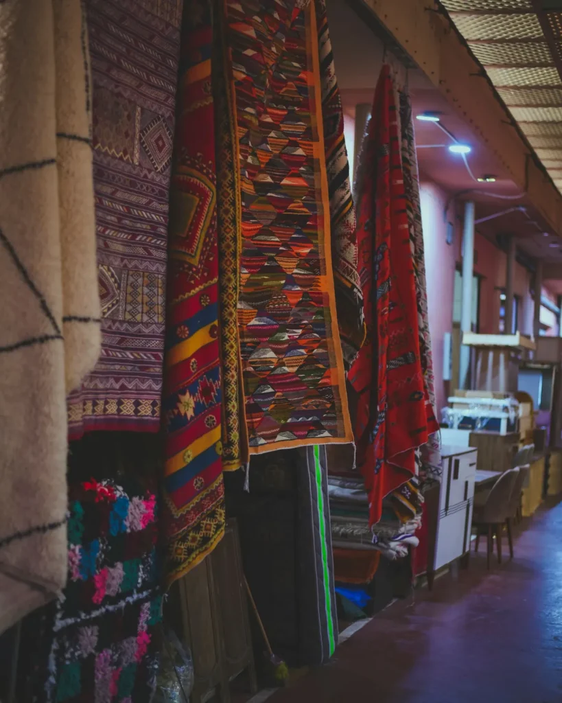 Berber rugs hanging in a shop of the Agadir souk