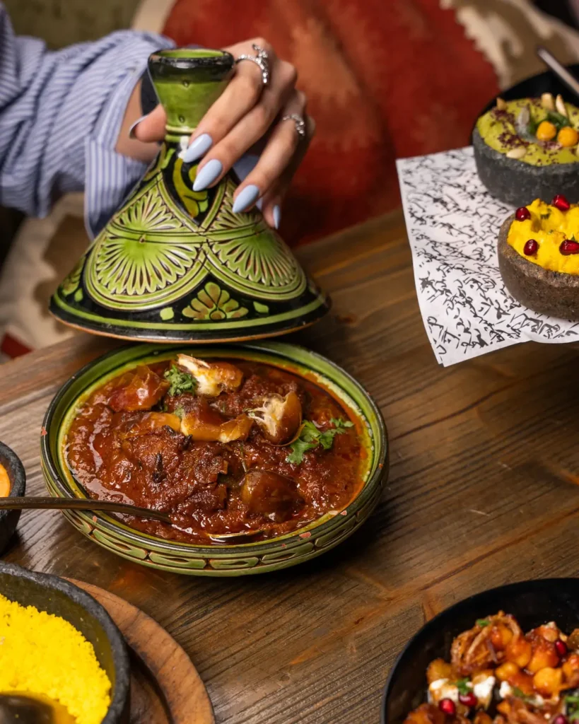 Moroccan meal with tagine, couscous and side dishes