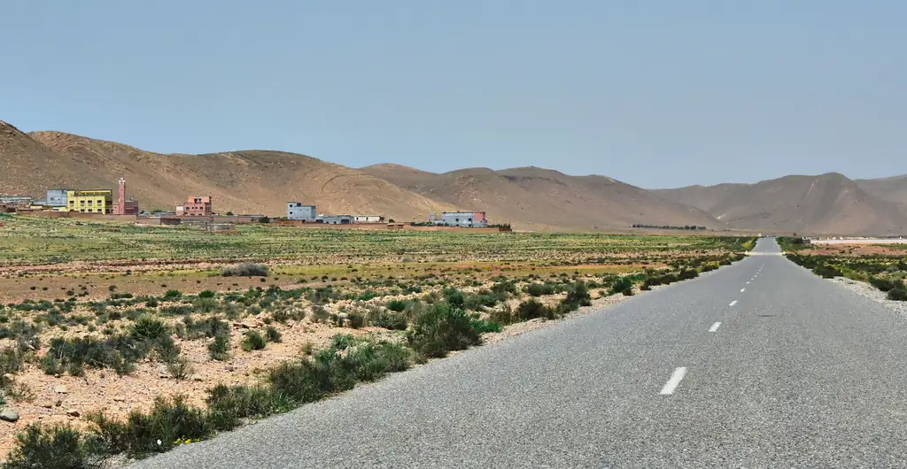 Open road in Morocco with mountains on the horizon