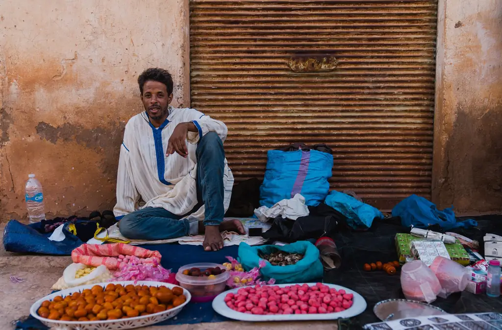 Street vendor selling goods at a weekly market in the Souss region
