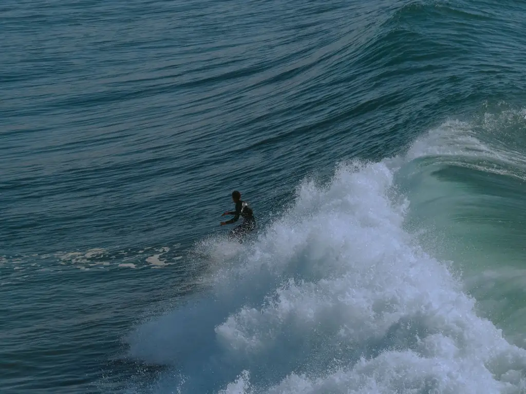 Surfer riding a wave in Taghazout, north of Agadir